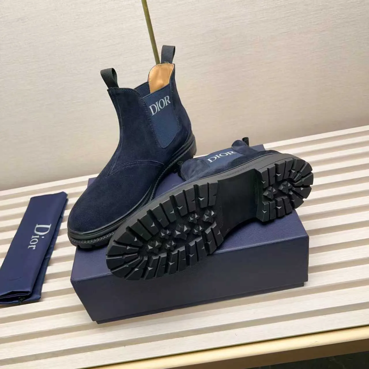 Men's Shoes 💰480 Dior A practical choice that combines protection with classic style. Made from durable Rugged Calf leather, it's tumbled and hand-finished to create a soft suede feel with a rich texture. Elastic side panels and subtle cutouts are inspired by the classic Chelsea boot. Leather upper and lining with Kummel tabs at front and rear, rubber outsole